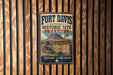 A vintage-style metal sign for Fort Davis National Historic Site in Texas, featuring an illustration of a historic building and a cannon.