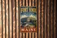 A vintage-style metal sign for Fort Knox State Historic Site in Maine, featuring an illustration of the fort and a cannon.