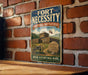 a vintage-style metal sign with the text "Fort Necessity National Battlefield Pennsylvania" and "The Birthplace of the United States of Pennsylvania" on a brick wall.