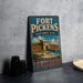 A vintage-style metal sign for the Fort Pickens Historic Site in Florida, featuring an illustration of the fort and surrounding landscape.