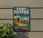 A vintage-style sign for Fort Pickens Historic Site in Florida, featuring a building and a beach scene.