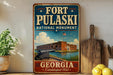 A vintage-style metal sign for Fort Pulaski, the National Monument in Georgia, featuring an illustration of the fort and its surroundings.