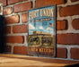 A vintage-style metal sign for Fort Union National Monument in New Mexico, featuring an image of the monument and a sign that says "A Place Where the Past Lives".