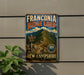 a vintage-style sign for the Franconia Ridge Loop in New Hampshire, with a mountain landscape and trail information.