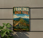 a vintage trail sign for the Franconia Ridge Trail, which is the highest trail in New England.