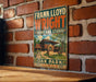 A vintage-style sign for Frank Lloyd Wright's Oak Park, Illinois studio, featuring a brick wall and a building illustration.