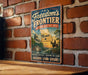 A vintage-style metal sign with the text "Freedom's Frontier National Heritage Area" and a map of Missouri, mounted on a brick wall.
