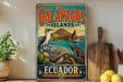 A vintage-style metal sign for Galápagos Islands, Ecuador, featuring illustrations of various animals and landscapes.