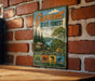 A vintage metal sign for Garrett State Forest, Maryland, mounted on a brick wall.