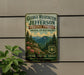 A vintage-style metal sign advertising George Washington and Jefferson National Forests in Virginia, with a mountain landscape and pine trees.