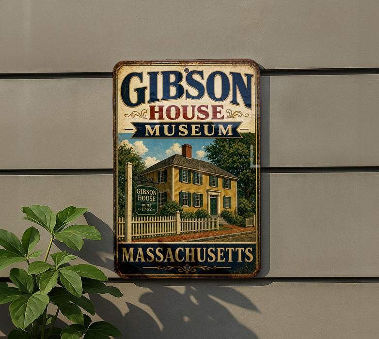 A vintage metal sign for the Gibson House Museum in Massachusetts, featuring an illustration of a yellow house with a white picket fence and a chimney.