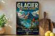 A vintage-style sign for the Glacier Biosphere Reserve in the United States, featuring a scenic mountain landscape with a lake and colorful wildflowers.