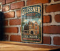 A vintage-style metal sign for the Glissner House in Illinois, featuring an illustration of the historic building and the text "Glissner House Chicago's Historic Treasure".
