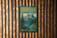 A vintage-style sign for Golden Ears Provincial Park in British Columbia, Canada, featuring a mountain landscape and a pine tree.