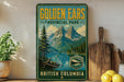 A vintage-style sign for Golden Ears Provincial Park in British Columbia, featuring a scenic mountain landscape with pine trees and a lake.
