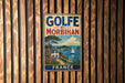 A vintage-style metal sign with the text "GOLFE DU MORBIAN FRANCE" is displayed on a wooden wall.