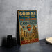 A vintage-style sign for the Göreme National Park and the Rock Sites in Cappadocia, Turkey, featuring a colorful illustration of hot air balloons and ancient ruins.