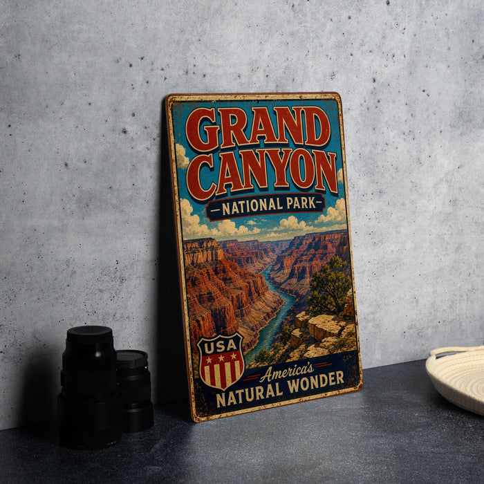 A vintage-style metal sign for the Grand Canyon National Park, featuring a scenic illustration of the canyon landscape.