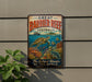 A vintage-style metal sign with the text "GREAT BARRIER REEF AUSTRALIA" and an illustration of a sea turtle swimming among colorful coral and fish.