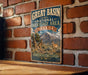 A vintage-style metal sign for the Great Basin National Heritage Area in Nevada, featuring a mountain landscape and wildlife.
