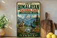 A vintage-style sign for the Great Himalayan National Park, featuring a mountain landscape with a goat and a peacock, along with the text "Great Himalayan National Park Conservation Area" and "Himachal Pradesh, India".