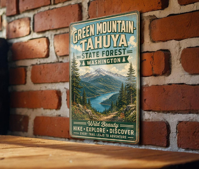 A vintage-style metal sign for Green Mountain- Tahya State Forest in Washington, featuring a scenic mountain landscape with pine trees and a lake.