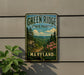 A vintage-style metal sign for the Green Ridge State Forest in Maryland, featuring a scenic landscape with pine trees, mountains, and a winding path.