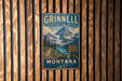 A vintage metal sign for the Grinnell Glacier Trail in Montana, featuring a scenic mountain landscape.
