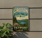 A vintage-style metal sign for Groton State Forest, featuring a scenic landscape with pine trees, mountains, and a lake.