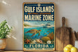 A vintage-style metal sign for the Gulf Islands National Seashore Marine Zone, featuring an illustration of a turtle swimming among coral and fish, with a boat in the background.