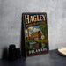 A vintage metal sign for the Hagley Museum and Estate in Delaware, featuring an illustration of a building and a waterfall.