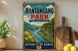 a vintage-style sign for Hantangg Park, the Republic of Korea, with a scenic illustration of a river and mountains.