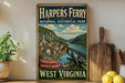 A vintage-style metal sign for the Harpers Ferry National Historical Park in West Virginia, featuring a scenic illustration of the park and its surroundings.