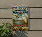 A vintage-style metal sign for the Harris Neck National Wildlife Refuge in Georgia, featuring illustrations of birds and wetlands.