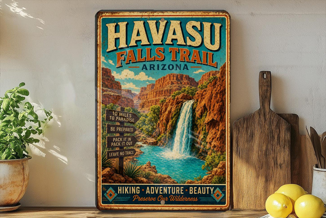 A vintage-style metal sign for Havasu Falls Trail in Arizona, featuring a waterfall and desert landscape.