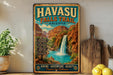 A vintage-style metal sign for Havasu Falls Trail in Arizona, featuring a waterfall and desert landscape.