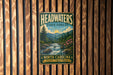 A vintage-style metal sign for Headwaters State Forest in North Carolina, featuring a scenic landscape with a river, mountains, and pine trees.