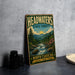 A vintage-style metal sign for Headwaters State Forest, featuring a scenic mountain landscape with a river and pine trees.