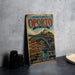 A vintage-style metal sign for the Historic Centre of Porto, Portugal, featuring an illustration of the Quijz Bridge and surrounding buildings.