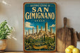 A vintage-style metal sign for the Historic Centre of San Gimignano, Italy, featuring a painting of the city's skyline.