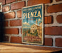 A vintage-style metal sign for the Historic Centre of Pienza, Italy, featuring an illustration of a historic building and the text "RENAISSANCE BEAUTY TIMELESS HERITAGE".