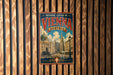 A vintage-style poster of Vienna, Austria, featuring the city's iconic architecture and landmarks, is displayed on a wooden wall.