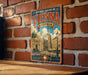 A vintage-style metal sign with the text "HISTORIC CENTRE OF VIENNA AUSTRIA" and an illustration of a cityscape, mounted on a brick wall.