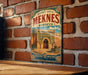 A vintage-style metal sign for the historic city of Meknes, Morocco, featuring an illustration of a palace or palace-like structure with palm trees and other traditional Moroccan architecture.
