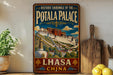 A vintage-style metal sign with a colorful illustration of the Potala Palace in Lhasa, Tibet, and the text "Historic Ensemble of the Potala Palace" and "Lhasa China".