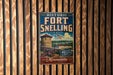A vintage-style metal sign for the historic Fort Snelling in Minnesota, featuring an illustration of a fort and a cannon.