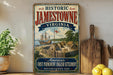 A vintage-style metal sign for Jamestown, Virginia, featuring an illustration of Jamestown and the English settlement.
