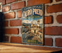 A vintage-style metal sign with the text "Historic Town of Oururo Preto" and an illustration of a historic town in Brazil.