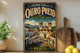 a vintage-style poster of a historic town of Ouro Preto, Brazil, with a church and other buildings depicted in a colorful and ornate illustration.