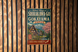 A vintage-style metal sign advertising the Historic Villages of Shirakawa-Go and Gokayama, Japan, with a scenic illustration of traditional Japanese houses and a mountain backdrop.